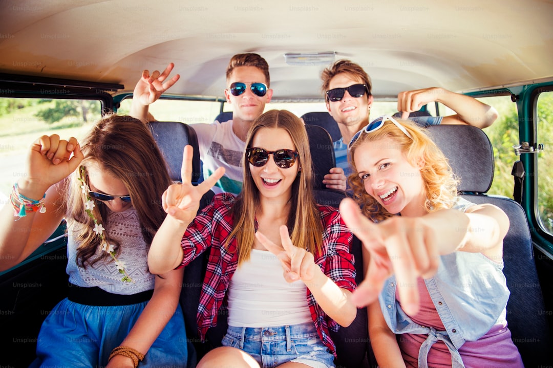 Young hipster friends on a road trip on a summers day